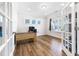 Bright office space with hardwood floors, a desk, and large windows at 608 Cormiche Ln, Wake Forest, NC 27587