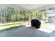 View of screened porch with grill and outdoor scenery at 608 Cormiche Ln, Wake Forest, NC 27587