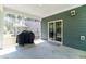 View of spacious screened porch with concrete flooring and access to backyard at 608 Cormiche Ln, Wake Forest, NC 27587