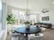 Bright living room features modern décor, large windows, and ample seating at 611 Walnut Hts Dr # 101, Raleigh, NC 27610