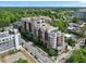 Attractive aerial view of the brick apartment building offering tree-lined street views and visible rooftop features at 618 N Boylan Ave # 400, Raleigh, NC 27603