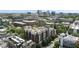 Stunning aerial view of building with red brick accents, surrounded by lush trees and city skyline in the background at 618 N Boylan Ave # 400, Raleigh, NC 27603