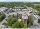 An aerial view of the building, complete with a pool and lush surrounding trees at 618 N Boylan Ave # 400, Raleigh, NC 27603