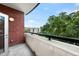 Cozy balcony with brick facade and calming outdoor view, perfect for relaxation at 618 N Boylan Ave # 400, Raleigh, NC 27603