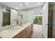 Elegant bathroom with double sinks, a large mirror, and a separate shower at 618 N Boylan Ave # 400, Raleigh, NC 27603