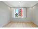 Empty bedroom with light hardwood floors and bright natural light coming through the window at 618 N Boylan Ave # 400, Raleigh, NC 27603