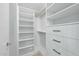 Organized walk-in closet featuring white shelving and drawers, with modern black hardware and ample storage space at 618 N Boylan Ave # 400, Raleigh, NC 27603