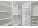 Walk-in closet with custom shelving and ample storage space for clothes and accessories at 618 N Boylan Ave # 400, Raleigh, NC 27603