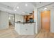 Modern kitchen with stainless steel appliances, breakfast bar, wood cabinets and backsplash tile at 618 N Boylan Ave # 400, Raleigh, NC 27603