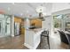 Communal kitchen with stainless steel fridge, an island with seating, and pool access at 618 N Boylan Ave # 400, Raleigh, NC 27603