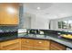 Bright kitchen with open floor plan features a double sink and granite countertops at 618 N Boylan Ave # 400, Raleigh, NC 27603
