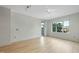 Bright, airy living room features hardwood floors, large windows, and neutral walls at 618 N Boylan Ave # 400, Raleigh, NC 27603