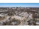 An aerial view of the neighborhood including townhomes with a city skyline at 620 Walnut Heights Dr # 103, Raleigh, NC 27610