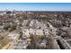 Aerial view of neighborhood with townhomes and a distant city skyline at 620 Walnut Heights Dr # 103, Raleigh, NC 27610