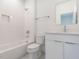 Bright bathroom with white subway tiles, shower, and modern vanity at 620 Walnut Heights Dr # 103, Raleigh, NC 27610
