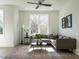 Bright living room with a comfortable sectional couch, decorative rug, and natural light from a large window at 620 Walnut Heights Dr # 103, Raleigh, NC 27610
