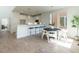 Open-concept living space with a modern kitchen, dining area, and bright natural light at 620 Walnut Heights Dr # 103, Raleigh, NC 27610