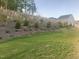 Sloping backyard with young trees and new ground cover at 633 Hardin Hill Ln, Knightdale, NC 27545