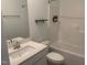 This bathroom boasts modern fixtures, a shower-tub combo, and a pristine white finish for a clean, refreshing space at 633 Hardin Hill Ln, Knightdale, NC 27545