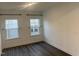 Well-lit room features hardwood floors, neutral walls, modern lighting and windows at 633 Hardin Hill Ln, Knightdale, NC 27545