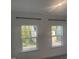 Bright bedroom windows offer nice views of the neighboring houses and backyard at 633 Hardin Hill Ln, Knightdale, NC 27545