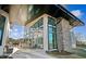 The building's exterior has large windows, a stone column, and a patio with seating at 633 Hardin Hill Ln, Knightdale, NC 27545