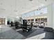 Spacious gym with modern equipment, large windows providing natural light, and rubber flooring at 633 Hardin Hill Ln, Knightdale, NC 27545