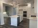 This is a gourmet kitchen featuring stainless appliances, a center island, and open-concept design for entertaining at 633 Hardin Hill Ln, Knightdale, NC 27545