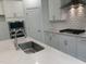 Bright kitchen featuring stainless steel appliances, quartz countertops, and a subway tile backsplash at 633 Hardin Hill Ln, Knightdale, NC 27545