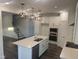A gourmet kitchen featuring stainless appliances, a center island, and open-concept design for entertaining at 633 Hardin Hill Ln, Knightdale, NC 27545