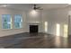Bright living room with fireplace, hardwood floors, neutral walls and lots of natural light at 633 Hardin Hill Ln, Knightdale, NC 27545