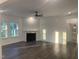 Spacious living room features hardwood floors, neutral walls, a fireplace and lots of natural light at 633 Hardin Hill Ln, Knightdale, NC 27545