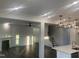 This bright open-concept living area flows from the kitchen and features a fireplace and hardwood floors at 633 Hardin Hill Ln, Knightdale, NC 27545