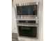 Modern stainless steel microwave and oven combo featuring digital displays and sleek design at 633 Hardin Hill Ln, Knightdale, NC 27545