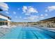 Resort-style pool with ample lounge seating, pergolas, and clear blue water, perfect for relaxation at 633 Hardin Hill Ln, Knightdale, NC 27545