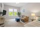 Cozy bedroom with window view and sitting area at 66 Romie Ct, Pittsboro, NC 27312