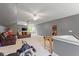 Open bonus room with seating, foosball table, and gym equipment offering versatile entertainment options at 66 Romie Ct, Pittsboro, NC 27312