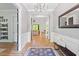 Inviting entryway with hardwood floors, stylish decor, and seamless transition to the living areas at 66 Romie Ct, Pittsboro, NC 27312