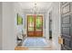 Elegant foyer with hardwood floors, a stylish light fixture, and a welcoming atmosphere at 66 Romie Ct, Pittsboro, NC 27312
