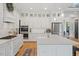 Well-equipped kitchen features a large island, stainless steel appliances, and ample white cabinetry at 66 Romie Ct, Pittsboro, NC 27312