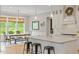 Beautiful kitchen featuring a large island, pendant lights, and a dining nook bathed in natural light at 66 Romie Ct, Pittsboro, NC 27312