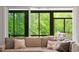 Cozy living room nook with windows and plush seating, perfect for relaxation and enjoying the view at 66 Romie Ct, Pittsboro, NC 27312