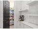 Walk-in pantry with organized shelving, a black door, and room for all your storage needs at 66 Romie Ct, Pittsboro, NC 27312