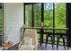 Relaxing outdoor bar with serene nature views, chair, and barstool seating at 66 Romie Ct, Pittsboro, NC 27312