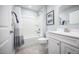 Bright bathroom featuring a shower and bath, tiled floors and a white vanity at 70 Saintsbury Dr, Fuquay Varina, NC 27526