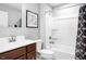 Bathroom with a wood cabinet and framed tub shower at 70 Saintsbury Dr, Fuquay Varina, NC 27526