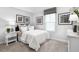 Serene bedroom with soft lighting and stylish furnishings, ideal for relaxation and rest at 70 Saintsbury Dr, Fuquay Varina, NC 27526