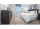 Comfortable bedroom featuring carpeted floors and plenty of natural light from the window at 70 Saintsbury Dr, Fuquay Varina, NC 27526