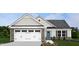Charming home featuring a white garage door with stone accents and a welcoming blue front door with a landscaped front yard at 70 Saintsbury Dr, Fuquay Varina, NC 27526