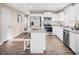 Modern kitchen featuring stainless steel appliances, white cabinets, and a center island at 70 Saintsbury Dr, Fuquay Varina, NC 27526